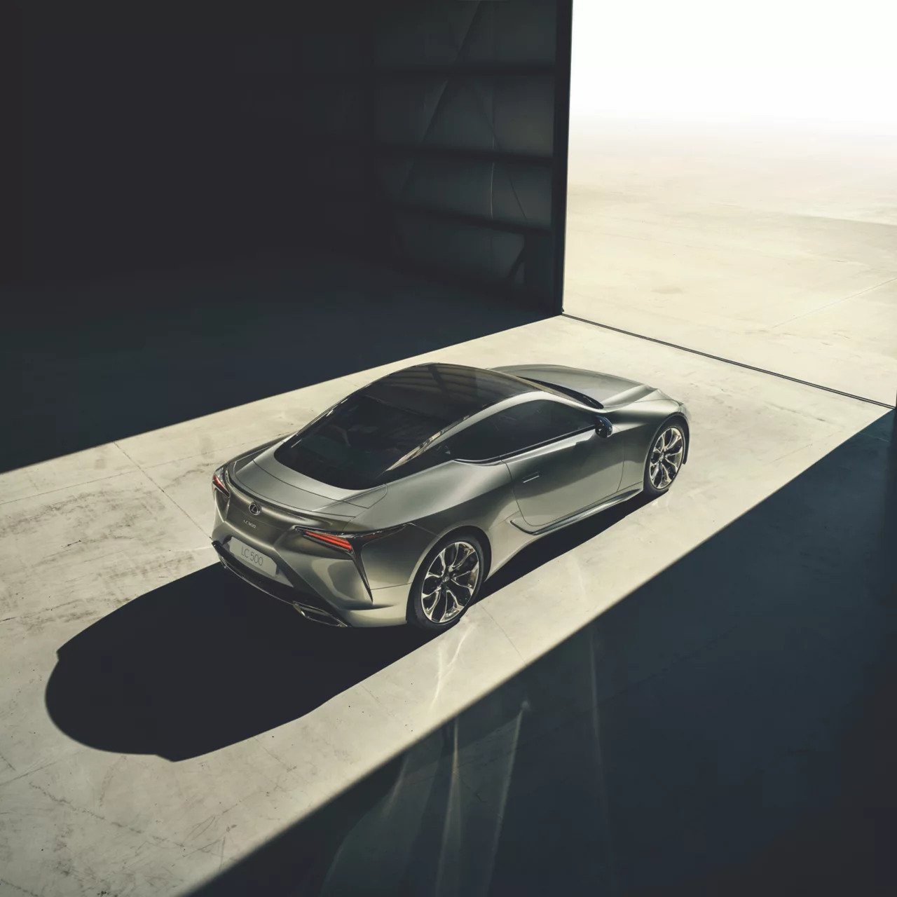 Lexus LC driving through a town