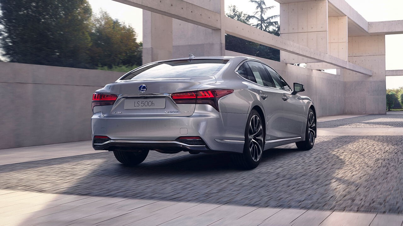 Rear view of a Lexus LS driving 