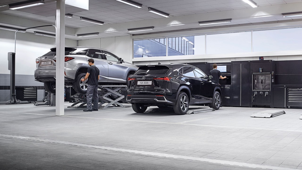 A Lexus RX 450h and NX 300h in a garage 